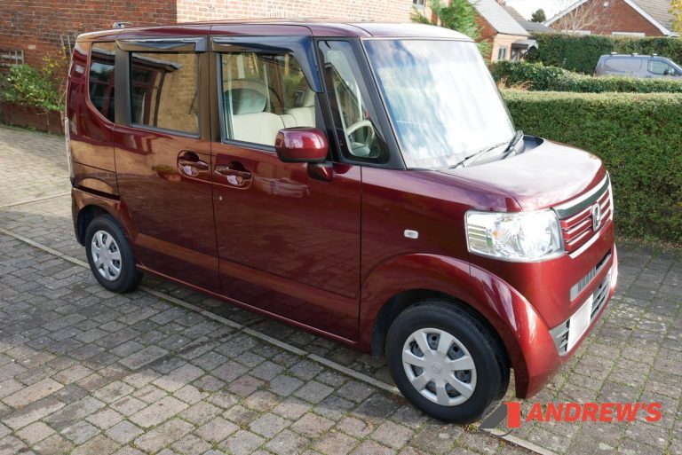 Front right quarter view showing red garnet pearl paint in sunlight - 2012 Honda NBox for sale