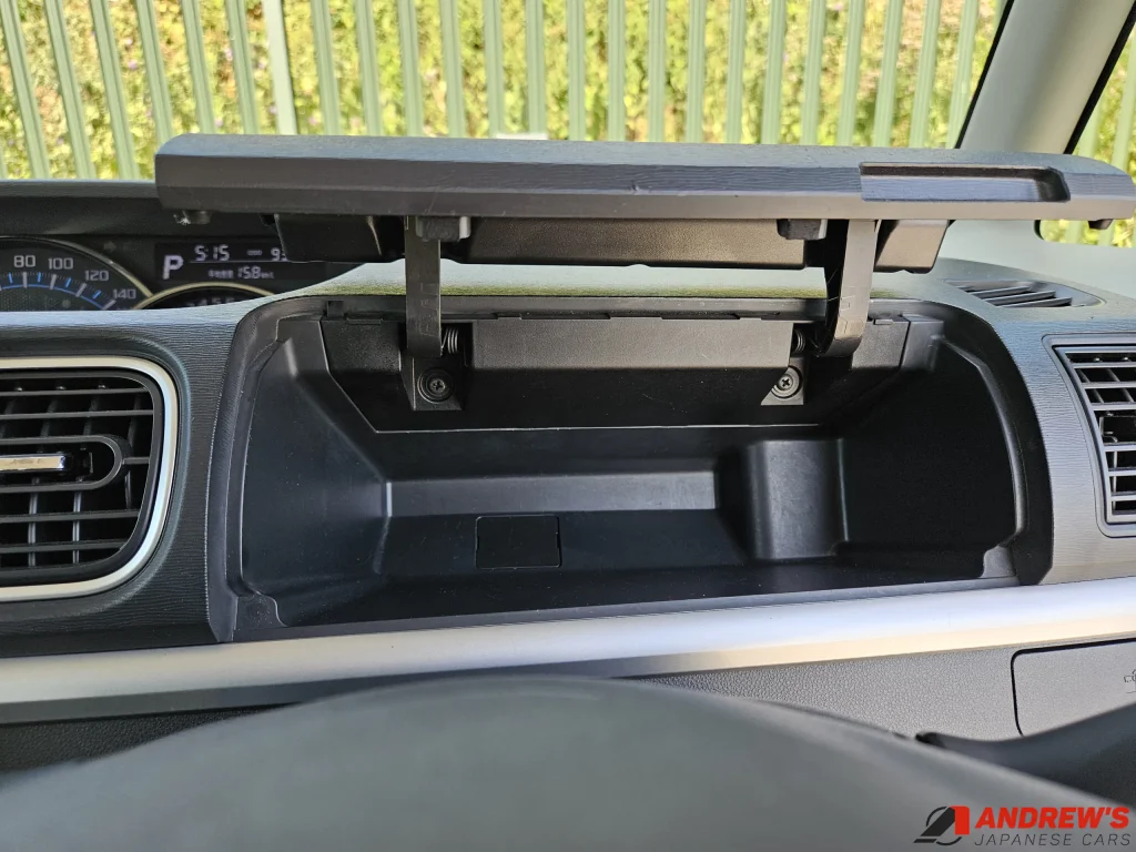 Picture showing driver's side storage compartment on the dashboard of a 2014 Daihatsu Tanto Custom RS SA