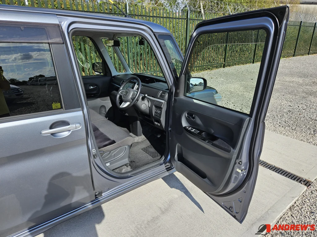 Picture showing the driver's door open on a Daihatsu Tanto Custom RS SA
