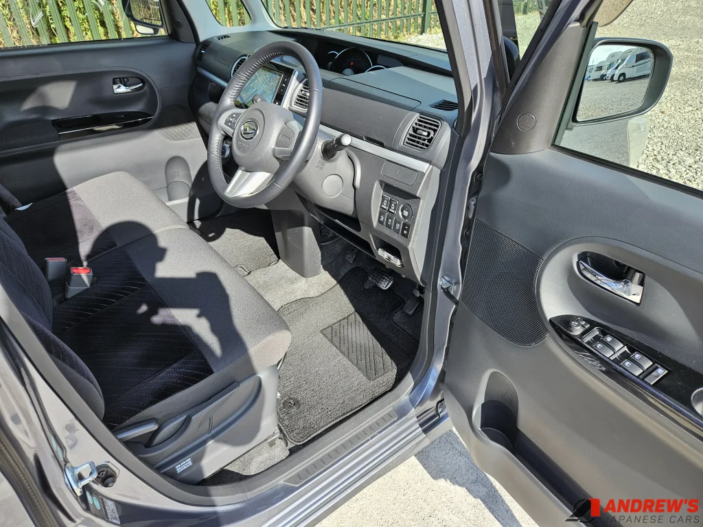 Picture showing the steering wheel and front seats on a 2014 Daihatsu Tanto Custom RS SA