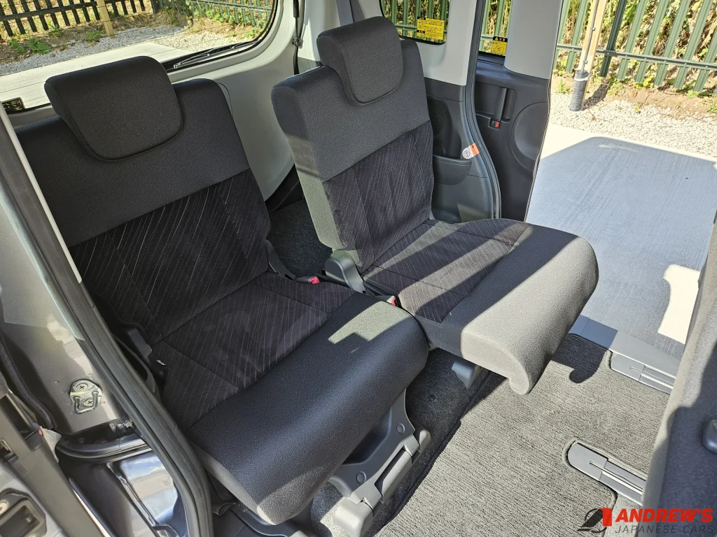 Picture showing the difference in rear seat placement to adjust leg room and boot space in a 2014 Daihatsu Tanto Custom RS
