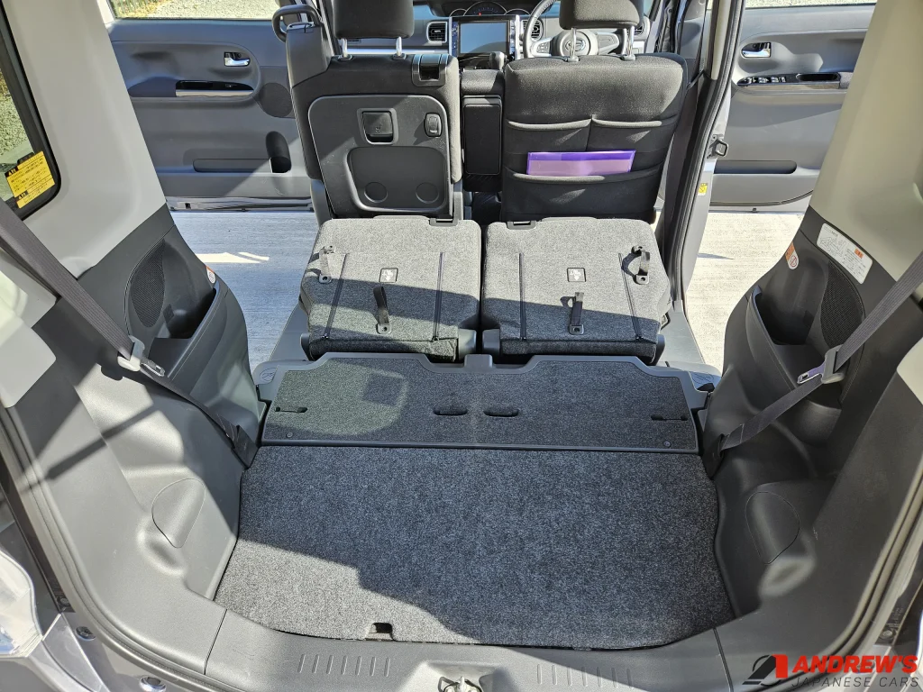 Picture showing the boot space in a 2014 Daihatsu Tanto with the rear seats folded flat to the floor