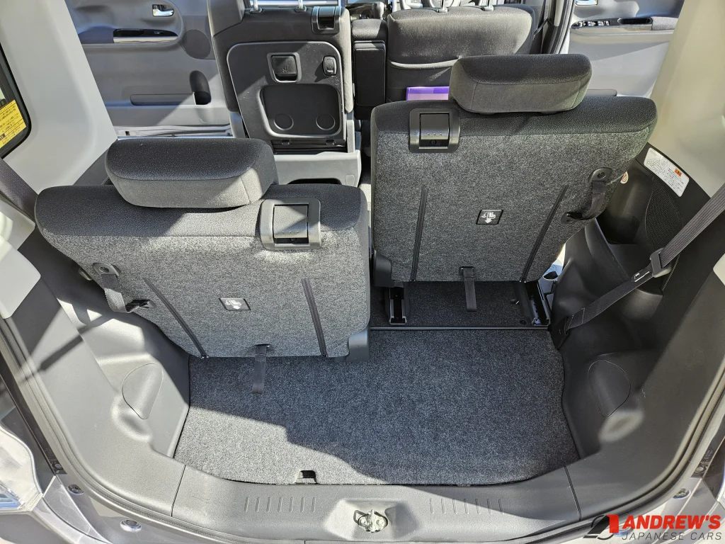 Picture showing the difference in boot space with varied rear seat placement in a 2014 Daihatsu Tanto Custom RS SA kei car from Japan